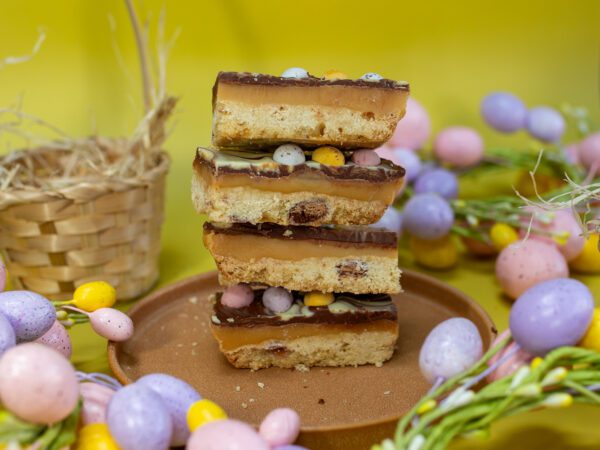 A stack of our Mini egg Millionaires slice, with a thick layer of Caramel a perfect gift this easter.